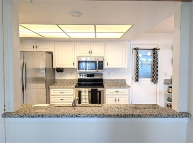 Under contract-accepting backup offers. Pride of ownership is on Mainlands Golf Club in Florida - for sale on GolfHomes.com, golf home, golf lot