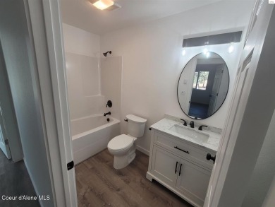 Charming 2-bedroom, 2-bath cottage nestled in a peaceful on Sandpoint Elks Golf Course in Idaho - for sale on GolfHomes.com, golf home, golf lot