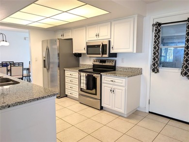 Under contract-accepting backup offers. Pride of ownership is on Mainlands Golf Club in Florida - for sale on GolfHomes.com, golf home, golf lot