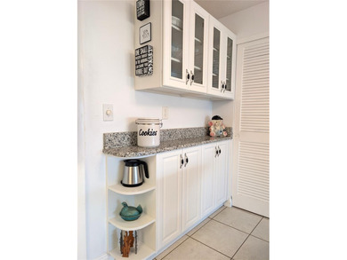 Under contract-accepting backup offers. Pride of ownership is on Mainlands Golf Club in Florida - for sale on GolfHomes.com, golf home, golf lot