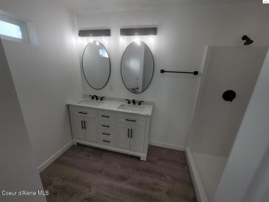 Charming 2-bedroom, 2-bath cottage nestled in a peaceful on Sandpoint Elks Golf Course in Idaho - for sale on GolfHomes.com, golf home, golf lot