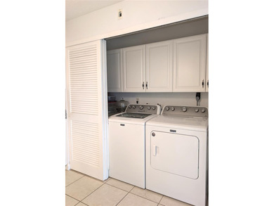 Under contract-accepting backup offers. Pride of ownership is on Mainlands Golf Club in Florida - for sale on GolfHomes.com, golf home, golf lot