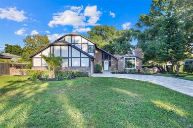 Not your cookie-cutter home.  This lovely Tudor offers character on Orange Tree Golf Club in Florida - for sale on GolfHomes.com, golf home, golf lot
