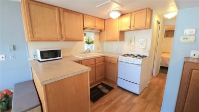 LOOKING FOR A FLORIDA GETAWAY? This cheerful one bed, 1 1/2 bath on River Run Golf Links in Florida - for sale on GolfHomes.com, golf home, golf lot