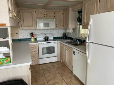 This very roomy 2 bedroom/2 bath home is on two lots and is on Deer Creek RV Golf Resort in Florida - for sale on GolfHomes.com, golf home, golf lot