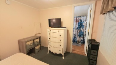 LOOKING FOR A FLORIDA GETAWAY? This cheerful one bed, 1 1/2 bath on River Run Golf Links in Florida - for sale on GolfHomes.com, golf home, golf lot