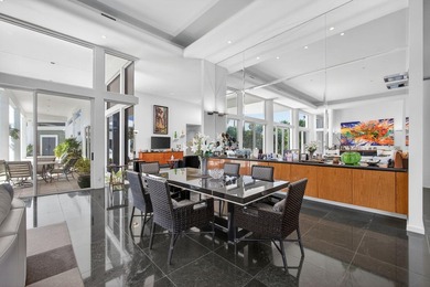 This exceptional home is a classic modern design proving the on Frenchmans Creek Country Club in Florida - for sale on GolfHomes.com, golf home, golf lot