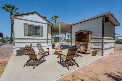 Welcome to your sunny desert retreat in the sought-after Palm on Palm Creek Golf and RV Resort in Arizona - for sale on GolfHomes.com, golf home, golf lot