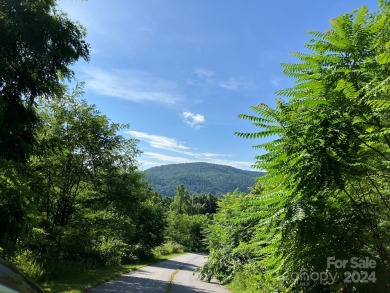 You don't have to go to West Virginia for a piece of heaven when on Rumbling Bald Resort on Lake Lure in North Carolina - for sale on GolfHomes.com, golf home, golf lot