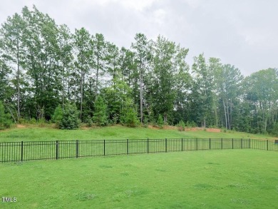 Nestled on a picturesque golf course lot, this thoughtfully on Olde Liberty Golf and Country Club in North Carolina - for sale on GolfHomes.com, golf home, golf lot