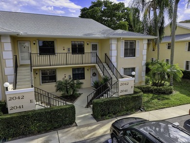 Rare first floor - corner unit in the centrally located Keystone on The Golf Club of Jupiter in Florida - for sale on GolfHomes.com, golf home, golf lot