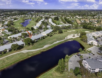 Rare first floor - corner unit in the centrally located Keystone on The Golf Club of Jupiter in Florida - for sale on GolfHomes.com, golf home, golf lot