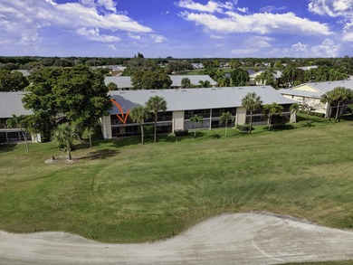 Rare first floor - corner unit in the centrally located Keystone on The Golf Club of Jupiter in Florida - for sale on GolfHomes.com, golf home, golf lot