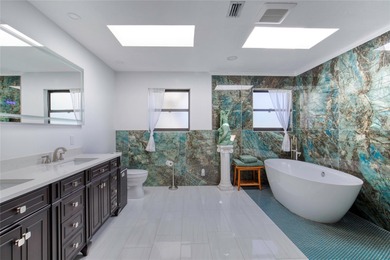 This extraordinary, designer-renovated 4-bedroom, 3-bath on Sugar Mill Country Club in Florida - for sale on GolfHomes.com, golf home, golf lot