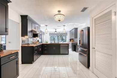 This extraordinary, designer-renovated 4-bedroom, 3-bath on Sugar Mill Country Club in Florida - for sale on GolfHomes.com, golf home, golf lot
