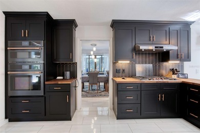 This extraordinary, designer-renovated 4-bedroom, 3-bath on Sugar Mill Country Club in Florida - for sale on GolfHomes.com, golf home, golf lot