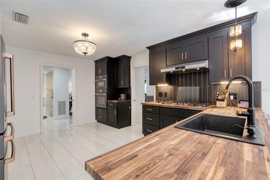 This extraordinary, designer-renovated 4-bedroom, 3-bath on Sugar Mill Country Club in Florida - for sale on GolfHomes.com, golf home, golf lot