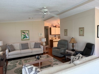 Priced to sell at $42,500 Monthly lot rent is $706 assumable on Pine Lakes Country Club in Florida - for sale on GolfHomes.com, golf home, golf lot