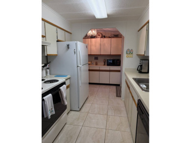 Priced to sell at $42,500 Monthly lot rent is $706 assumable on Pine Lakes Country Club in Florida - for sale on GolfHomes.com, golf home, golf lot
