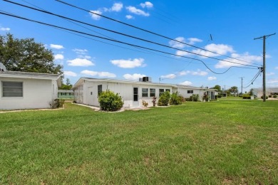 Adorable MOVE-IN READY 2-bedroom, 2-bathroom home with a POND on North Lakes Golf Course in Florida - for sale on GolfHomes.com, golf home, golf lot