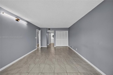 Thoughtfully updated with high-end finishes throughout, this on Palm-Aire Country Club and Resort - Palms in Florida - for sale on GolfHomes.com, golf home, golf lot