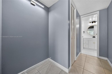 Thoughtfully updated with high-end finishes throughout, this on Palm-Aire Country Club and Resort - Palms in Florida - for sale on GolfHomes.com, golf home, golf lot
