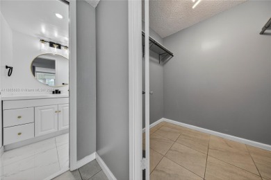 Thoughtfully updated with high-end finishes throughout, this on Palm-Aire Country Club and Resort - Palms in Florida - for sale on GolfHomes.com, golf home, golf lot