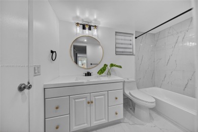 Thoughtfully updated with high-end finishes throughout, this on Palm-Aire Country Club and Resort - Palms in Florida - for sale on GolfHomes.com, golf home, golf lot