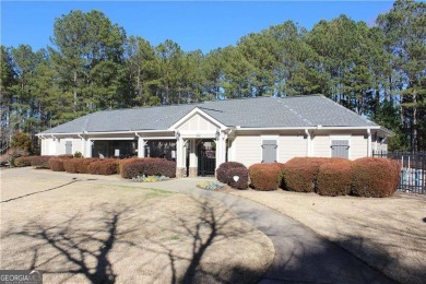 Nestled in the sought-after Towne Lake neighborhood within the on Canongate At Eagle Watch Golf Club in Georgia - for sale on GolfHomes.com, golf home, golf lot