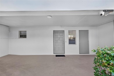 Thoughtfully updated with high-end finishes throughout, this on Palm-Aire Country Club and Resort - Palms in Florida - for sale on GolfHomes.com, golf home, golf lot