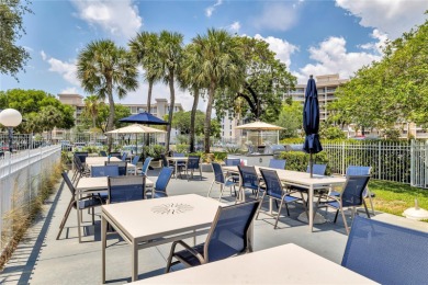 Thoughtfully updated with high-end finishes throughout, this on Palm-Aire Country Club and Resort - Palms in Florida - for sale on GolfHomes.com, golf home, golf lot