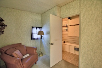 BEAUTIFUL FLORIDA OASIS located in a 55+ GATED community in the on Southern Dunes Golf and Country Club in Florida - for sale on GolfHomes.com, golf home, golf lot