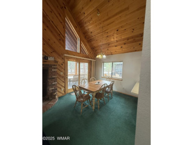 This Charming Mountain Retreat is tucked within the serene on Pinetop Lakes Country Club in Arizona - for sale on GolfHomes.com, golf home, golf lot
