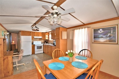 BEAUTIFUL FLORIDA OASIS located in a 55+ GATED community in the on Southern Dunes Golf and Country Club in Florida - for sale on GolfHomes.com, golf home, golf lot