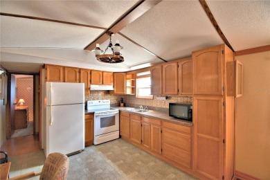 BEAUTIFUL FLORIDA OASIS located in a 55+ GATED community in the on Southern Dunes Golf and Country Club in Florida - for sale on GolfHomes.com, golf home, golf lot