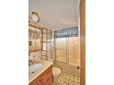 BEAUTIFUL FLORIDA OASIS located in a 55+ GATED community in the on Southern Dunes Golf and Country Club in Florida - for sale on GolfHomes.com, golf home, golf lot