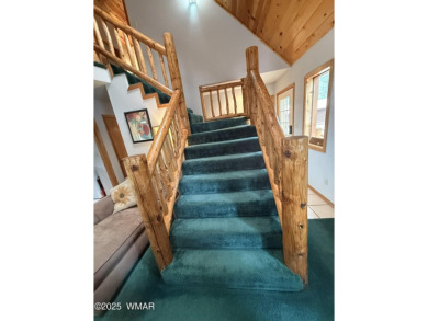 This Charming Mountain Retreat is tucked within the serene on Pinetop Lakes Country Club in Arizona - for sale on GolfHomes.com, golf home, golf lot