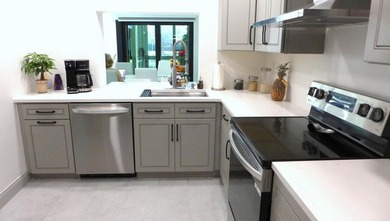 See this beautifully renovated, lake-front townhome superbly on Boca Delray Golf and Country Club in Florida - for sale on GolfHomes.com, golf home, golf lot