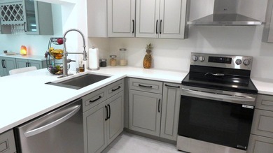 See this beautifully renovated, lake-front townhome superbly on Boca Delray Golf and Country Club in Florida - for sale on GolfHomes.com, golf home, golf lot