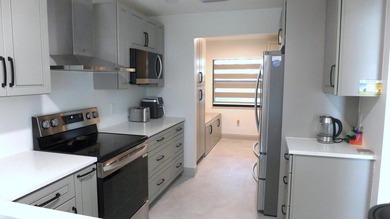 See this beautifully renovated, lake-front townhome superbly on Boca Delray Golf and Country Club in Florida - for sale on GolfHomes.com, golf home, golf lot