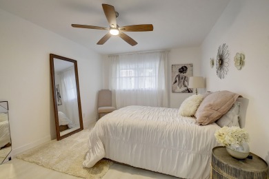 THIS BEAUTIFULLY DECORATED 2 BEDROOM 2 BATH CORNER VILLA IS on Kings Point Golf - Executive in Florida - for sale on GolfHomes.com, golf home, golf lot