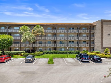 Wake up to peaceful water views and end your evenings surrounded on Wynmoor Golf Course in Florida - for sale on GolfHomes.com, golf home, golf lot