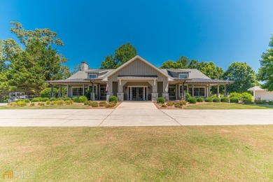 Exceptional corner lot with mature hardwoods and a golf course on The Orchard Golf and Country Club in Georgia - for sale on GolfHomes.com, golf home, golf lot