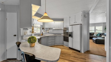 Trade your lawn mower for a fishing pole! This 55+ Lakeland on Wedgewood Golf Club in Florida - for sale on GolfHomes.com, golf home, golf lot