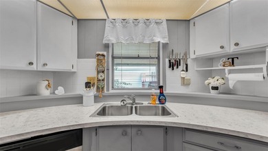 Trade your lawn mower for a fishing pole! This 55+ Lakeland on Wedgewood Golf Club in Florida - for sale on GolfHomes.com, golf home, golf lot