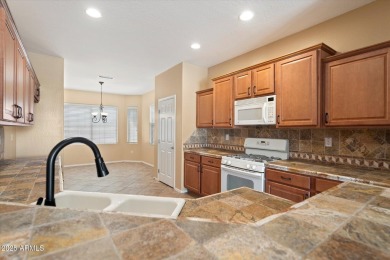 Nestled on a spacious .24-acre corner lot in the desirable on Cimarron Golf Club in Arizona - for sale on GolfHomes.com, golf home, golf lot