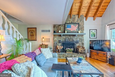 A Wrap Around Covered Porch, full of beautiful plants, welcomes on Sky Valley Resort and Country Club in Georgia - for sale on GolfHomes.com, golf home, golf lot
