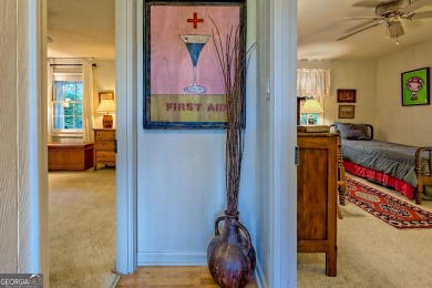 A Wrap Around Covered Porch, full of beautiful plants, welcomes on Sky Valley Resort and Country Club in Georgia - for sale on GolfHomes.com, golf home, golf lot