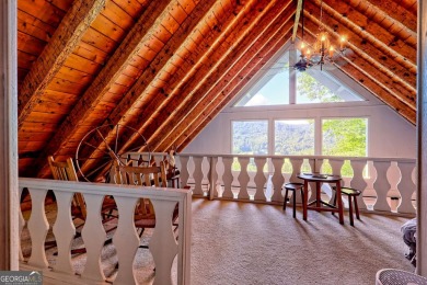 A Wrap Around Covered Porch, full of beautiful plants, welcomes on Sky Valley Resort and Country Club in Georgia - for sale on GolfHomes.com, golf home, golf lot