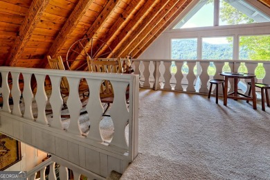 A Wrap Around Covered Porch, full of beautiful plants, welcomes on Sky Valley Resort and Country Club in Georgia - for sale on GolfHomes.com, golf home, golf lot